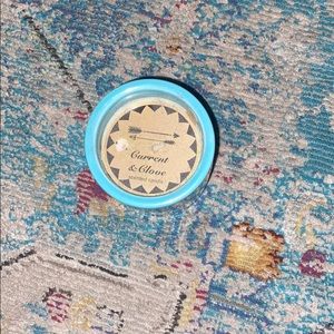 A blue smell good Current Glove scented candle